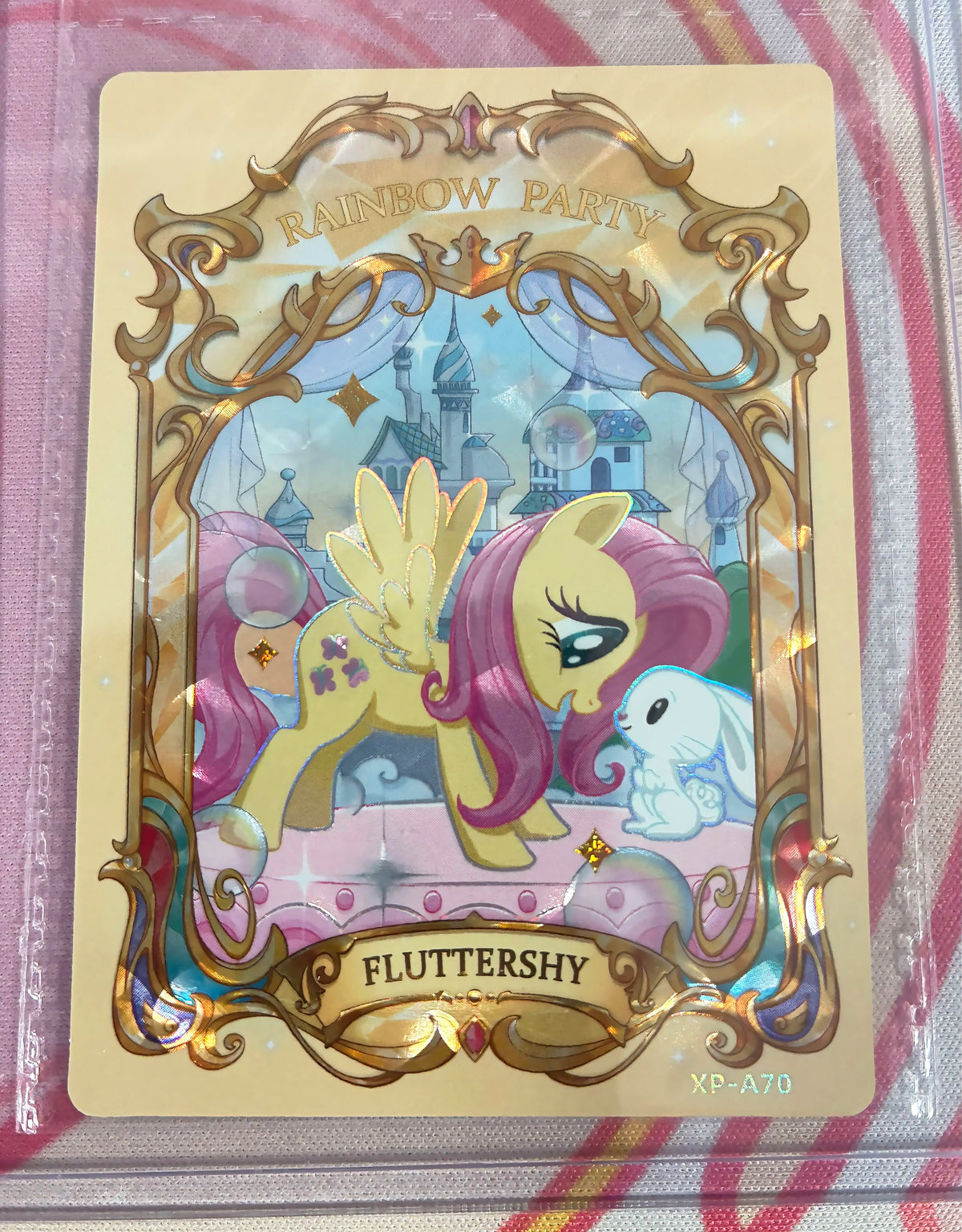 Fluttershy Rainbow Party collectible card, My Little Pony XP-A70, ornate gold-framed holographic art with Angel bunny